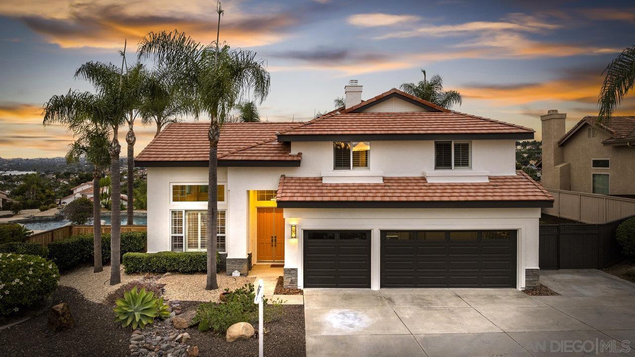 a front view of a house with a garage