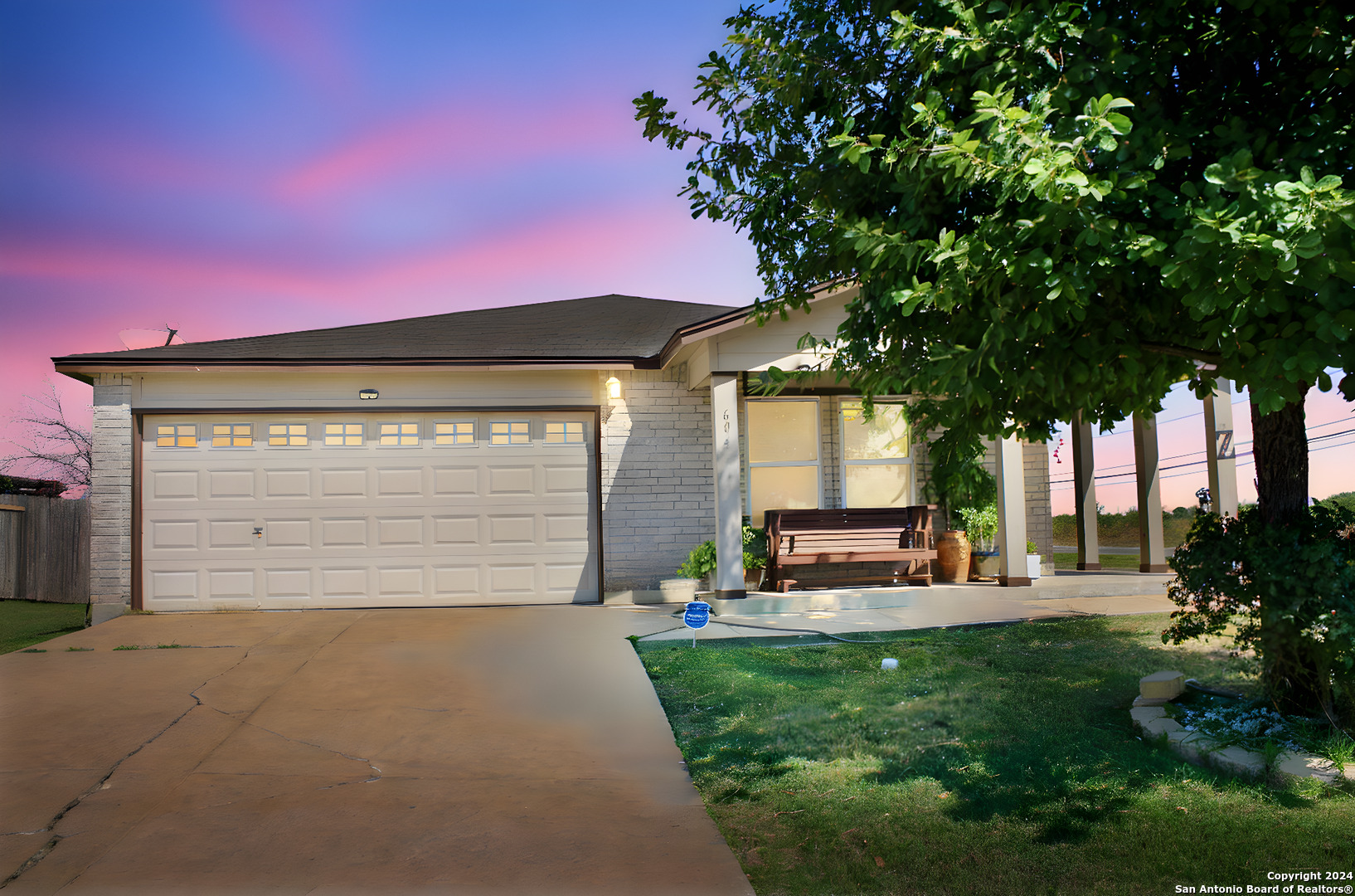 a view of a house with a backyard