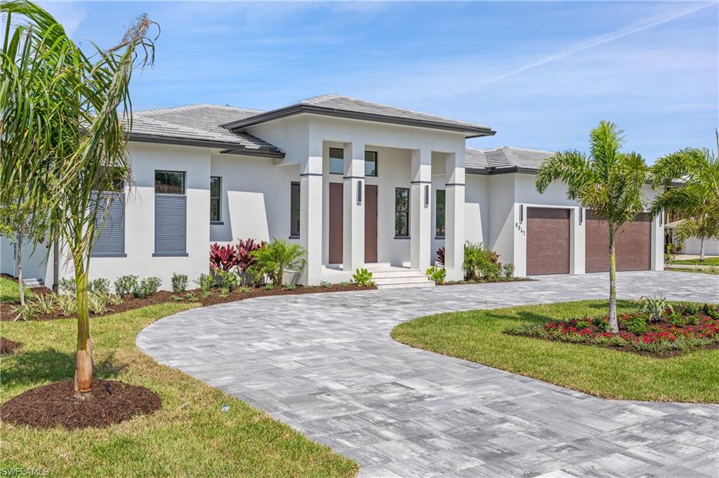 a front view of a house with a yard