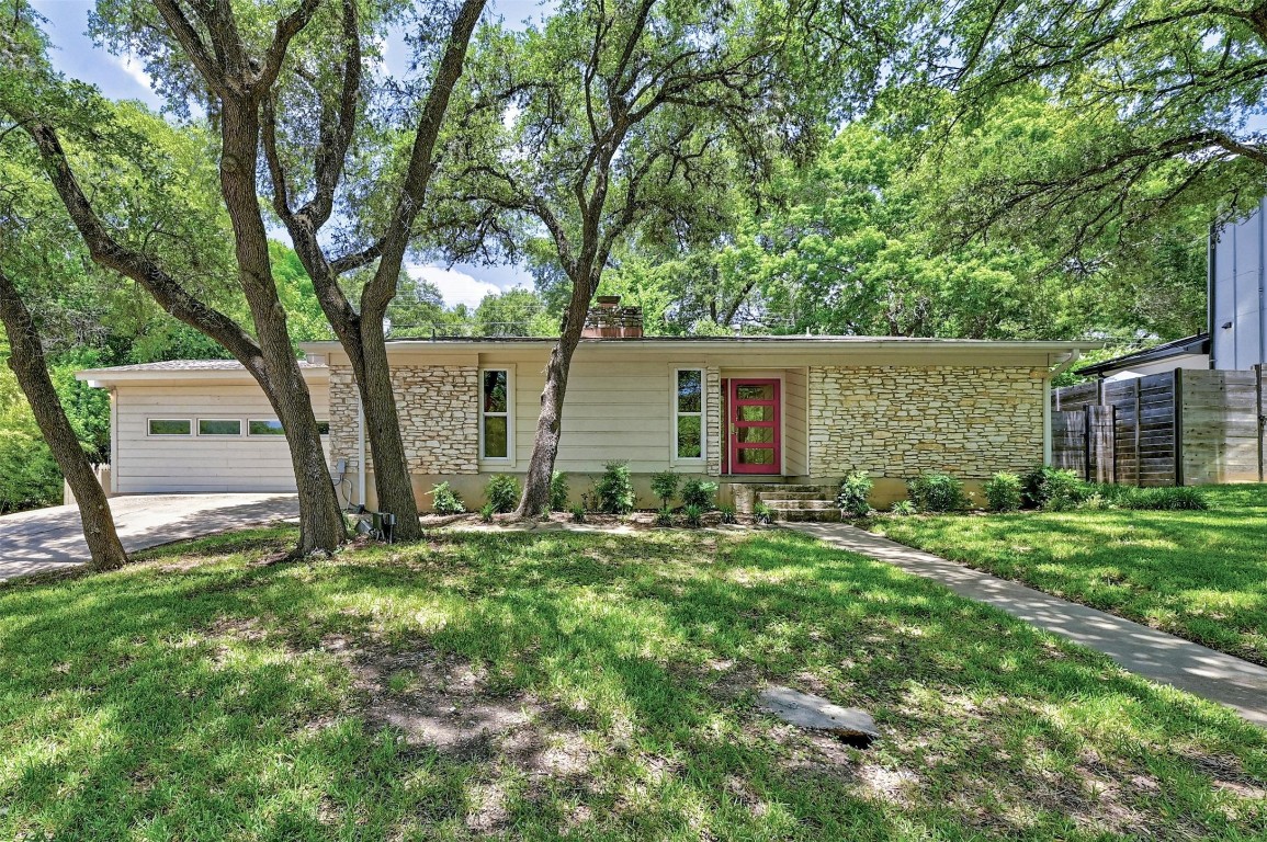 front view of a house with a yard