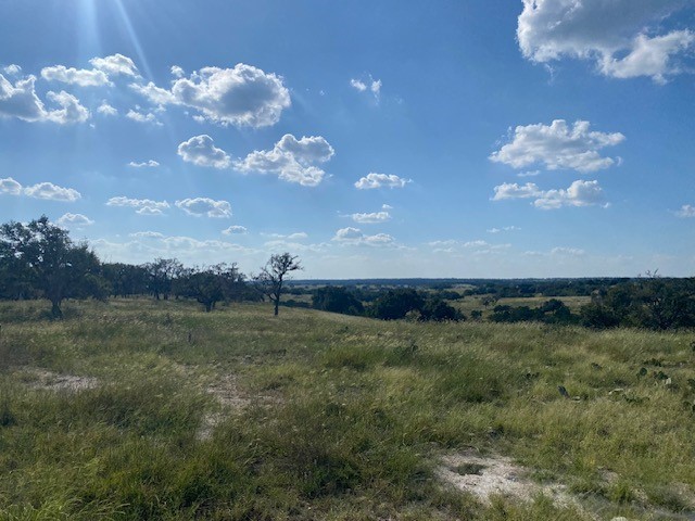 a view of a golf course with a lake