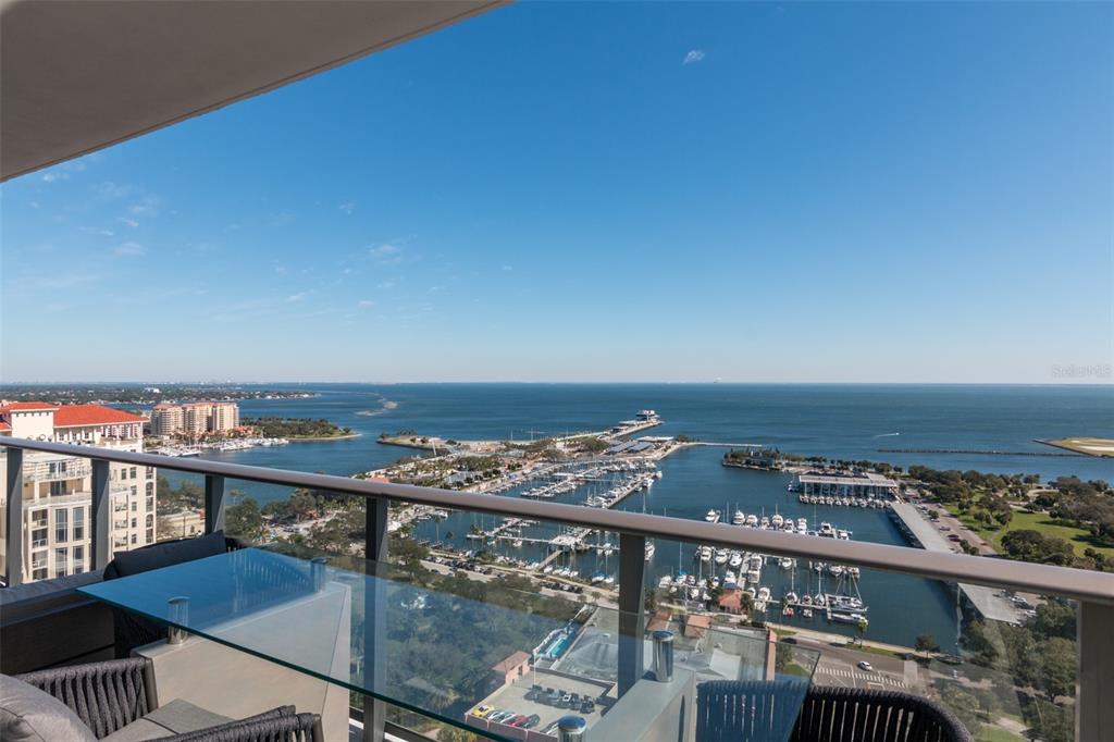 a view of a balcony with an ocean view