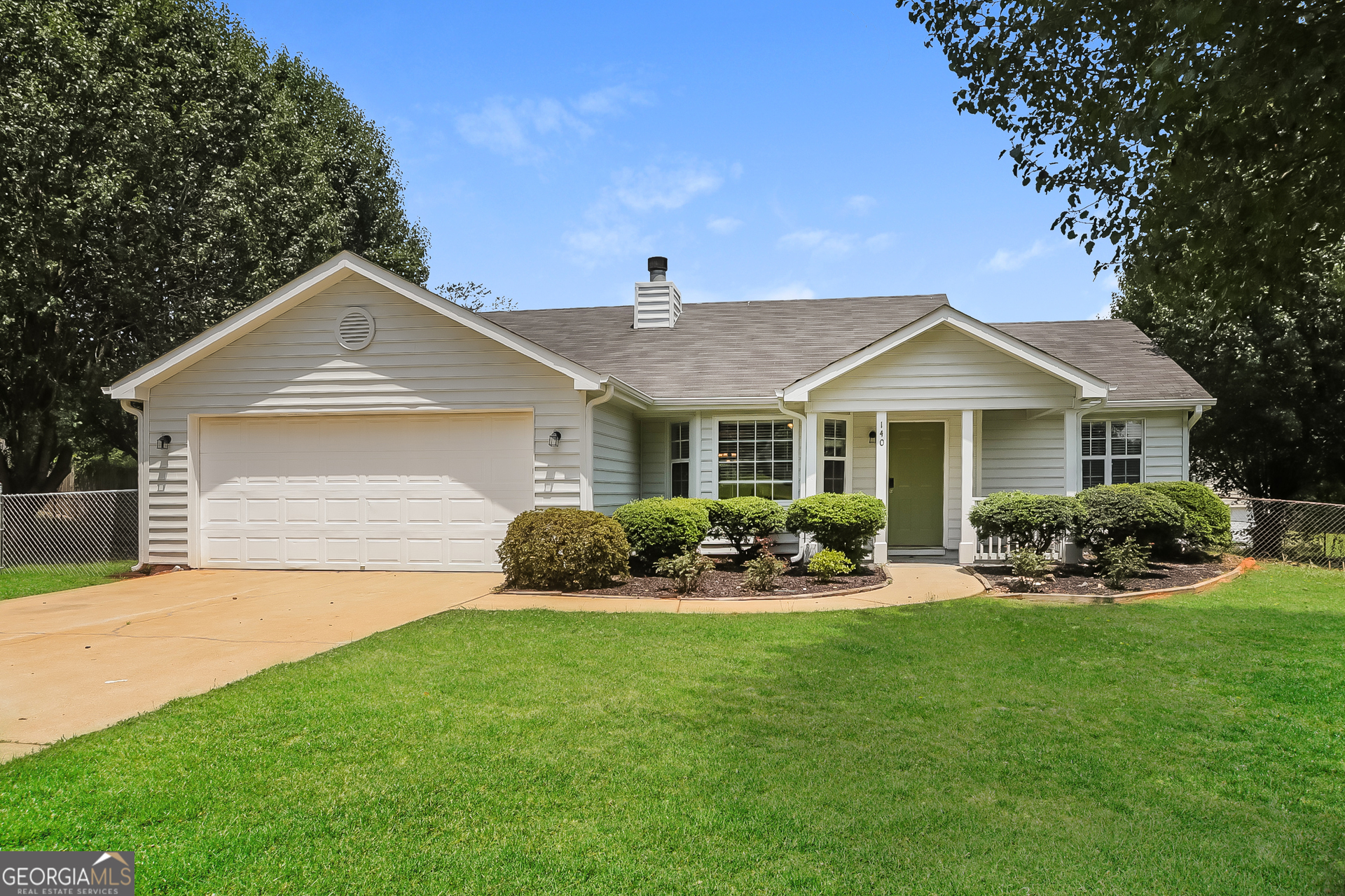 a front view of a house with a yard and porch