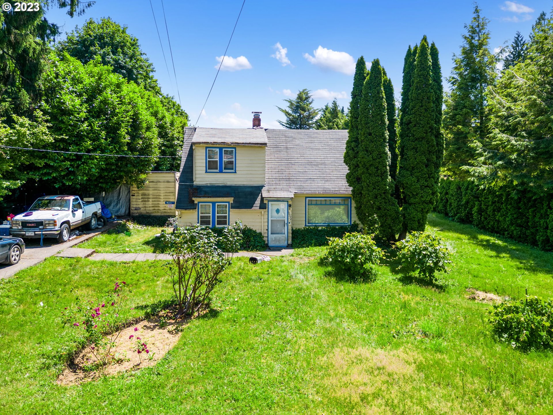 a front view of a house with garden