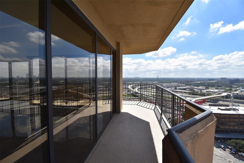 a view of balcony with furniture