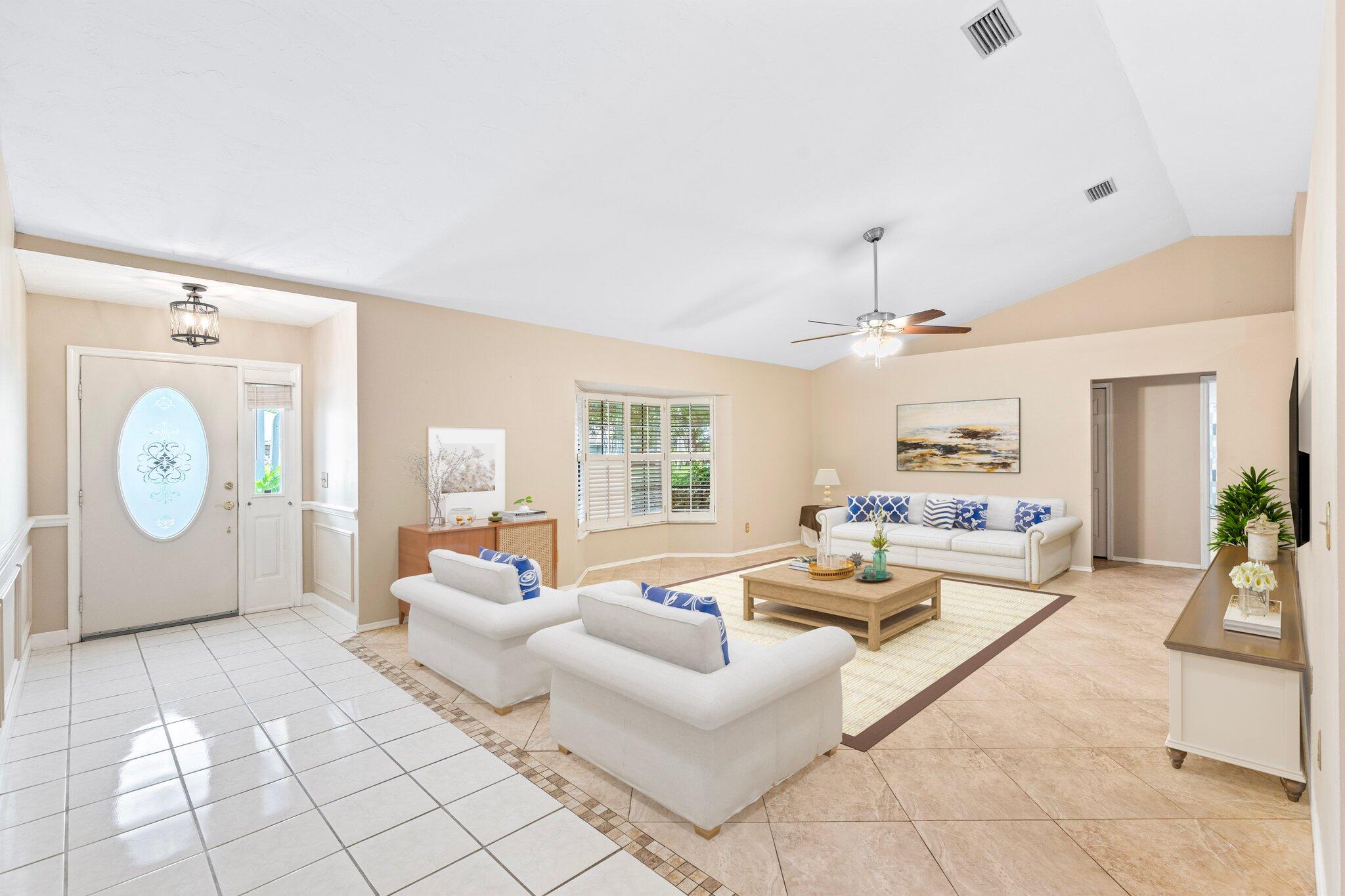 a living room with furniture a table and a clock