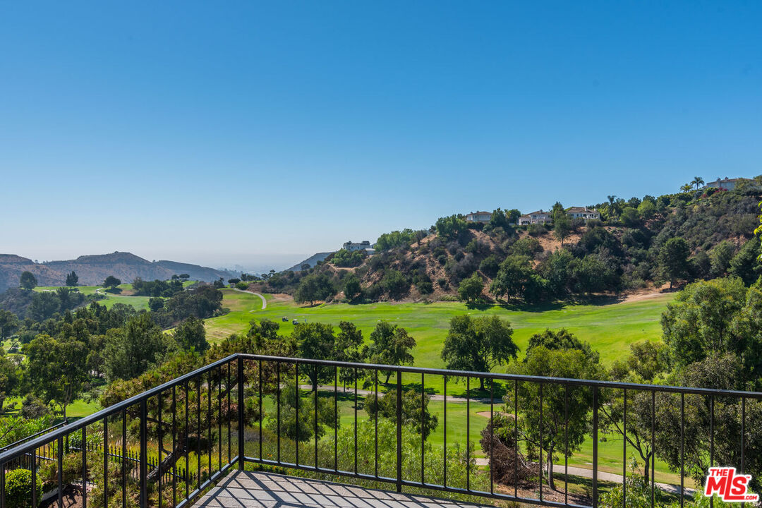 a view of a balcony with an outdoor space