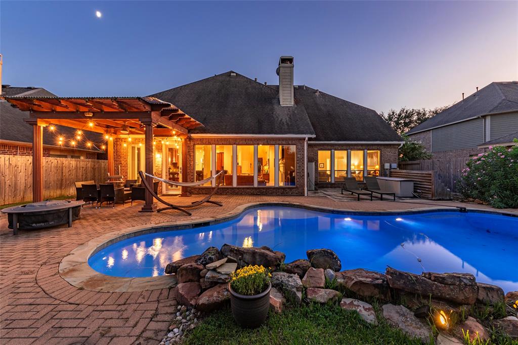 a swimming pool with an outdoor seating