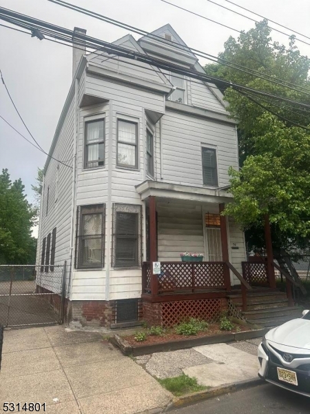 a front view of a house with parking