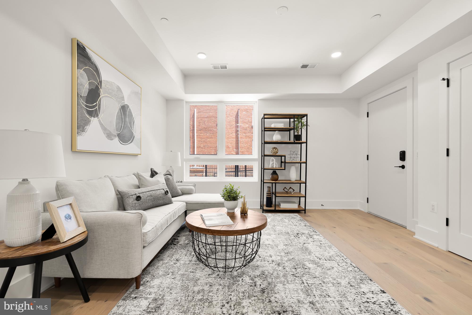 a living room with furniture and a rug