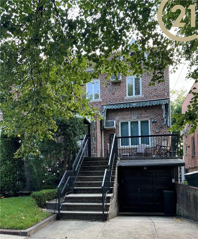 a front view of a house with a deck