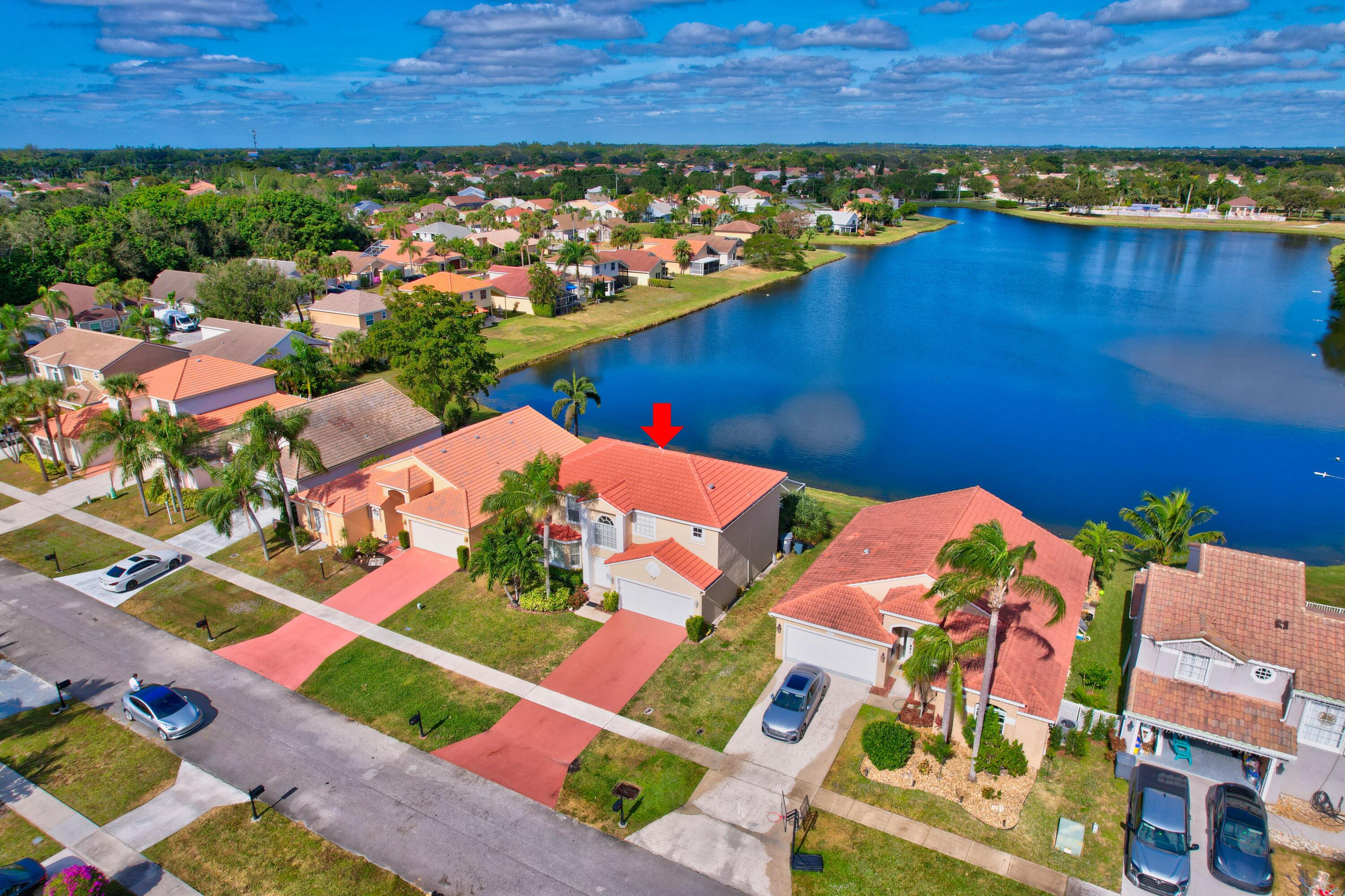 an aerial view of a house with a lake view