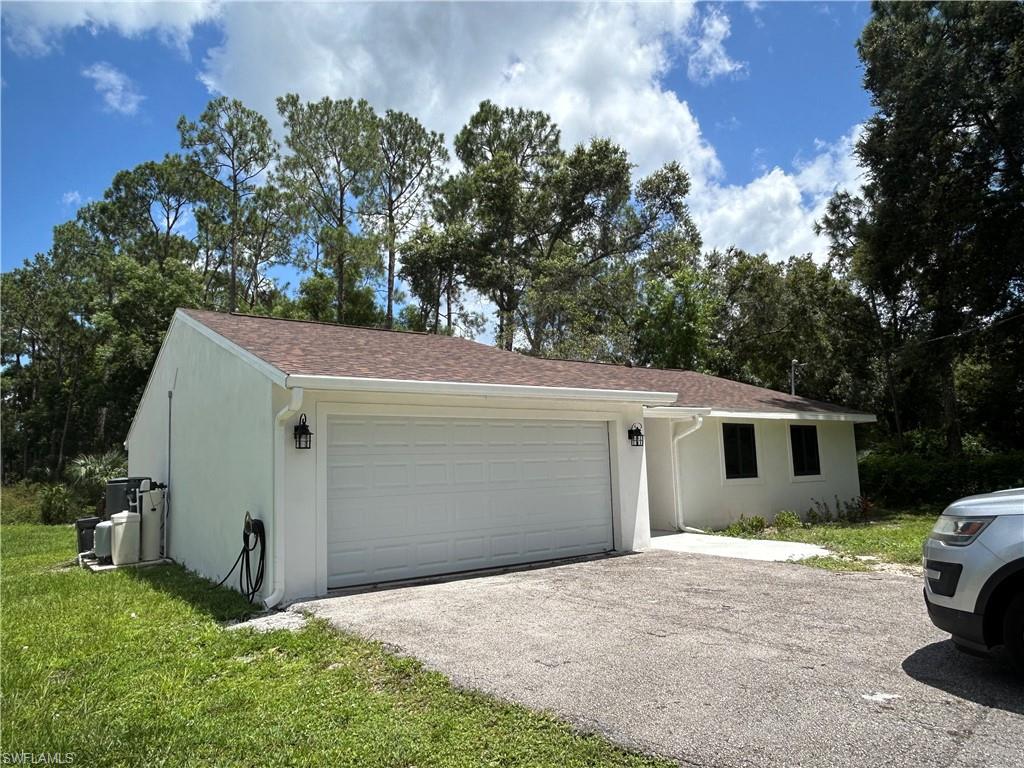 a view of garage and yard