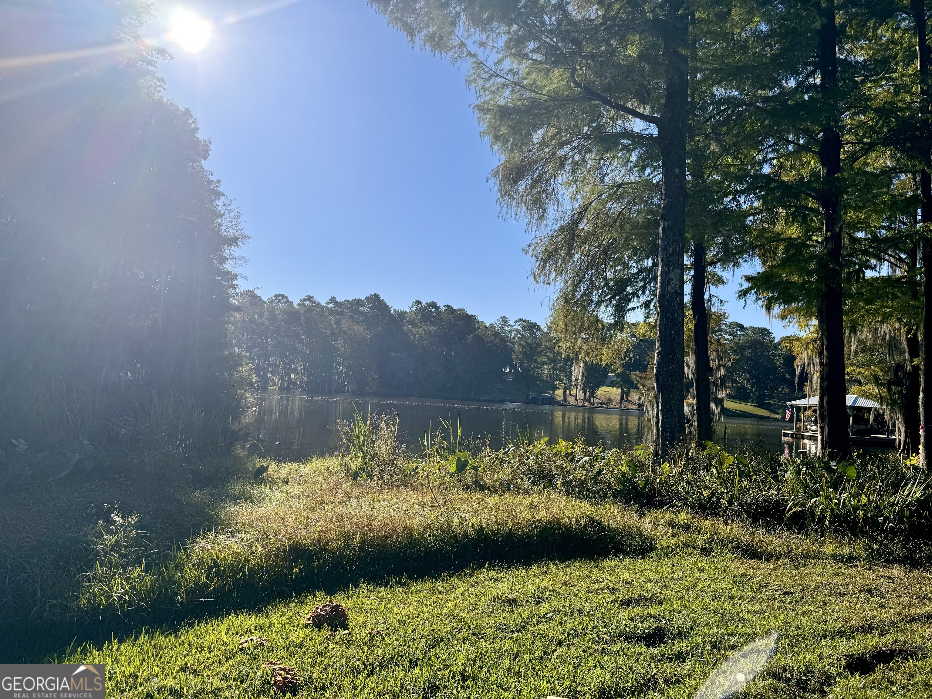 a view of a lake with a yard