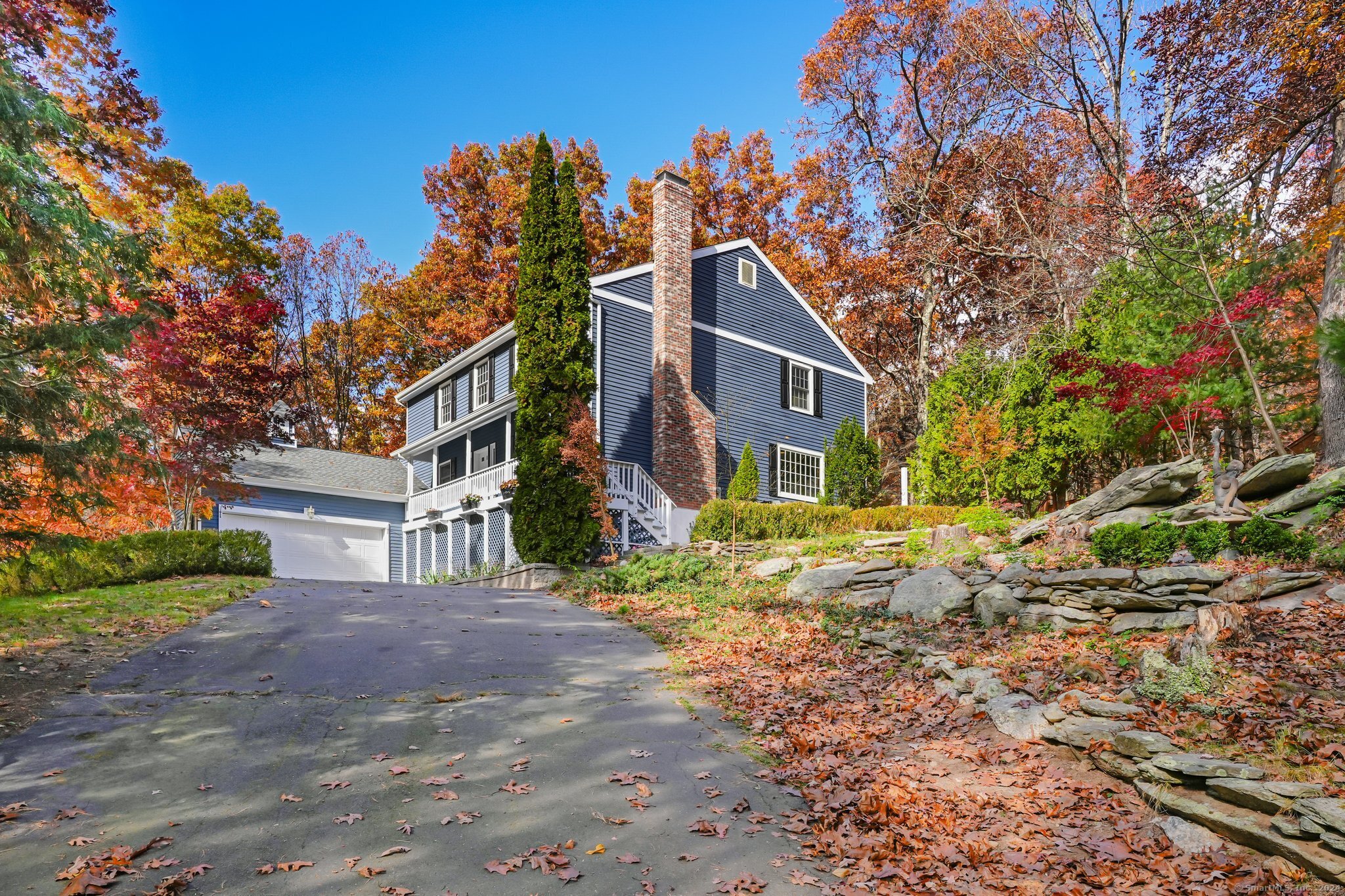 a view of a house with a tree in the background