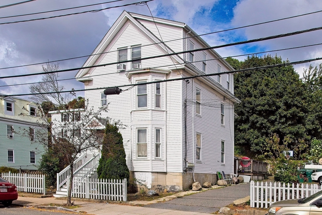 a view of a house with a street