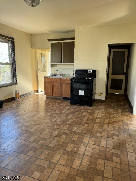 a view of kitchen with granite countertop cabinets and black the counter top