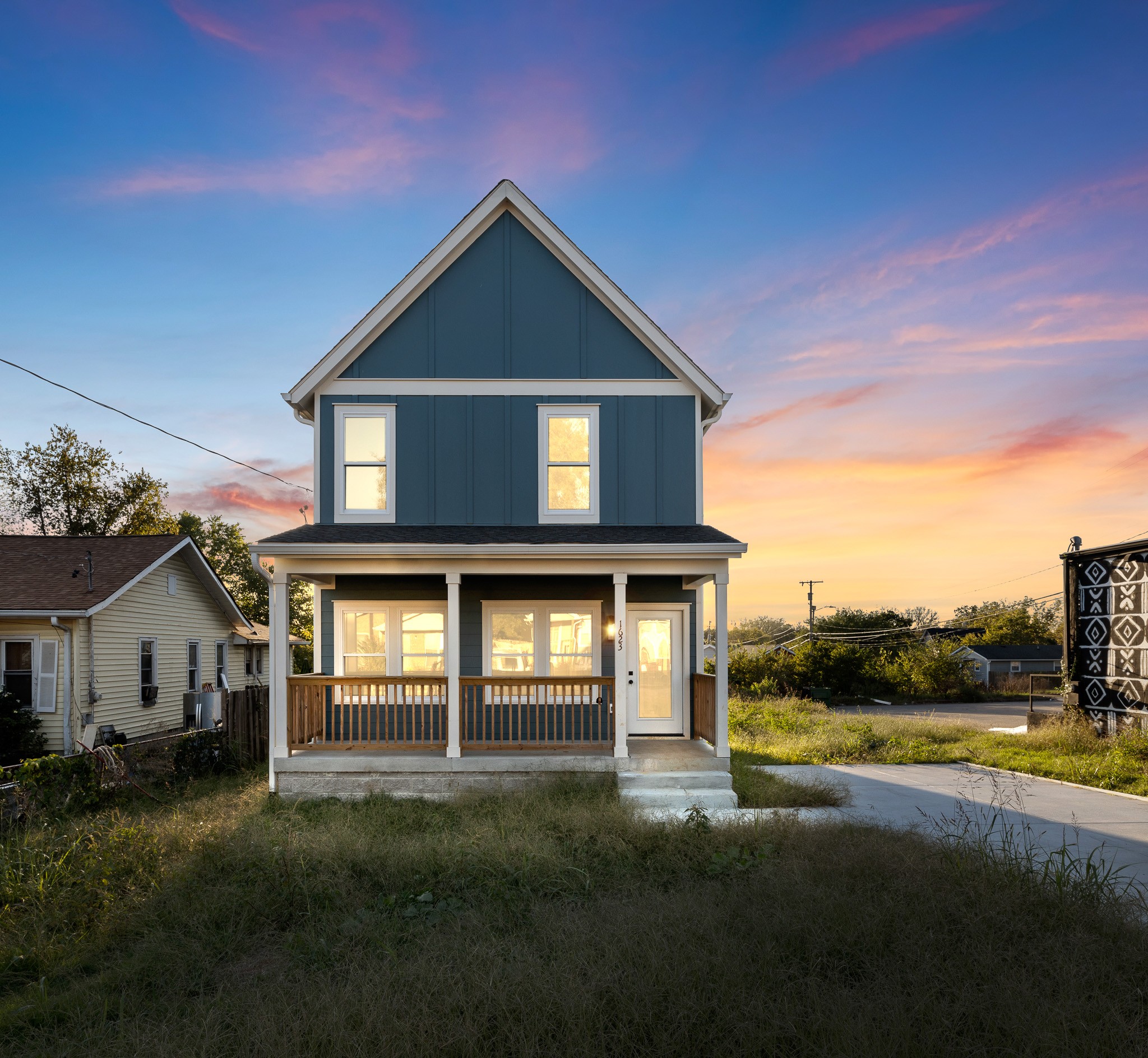 a front view of a house with a yard