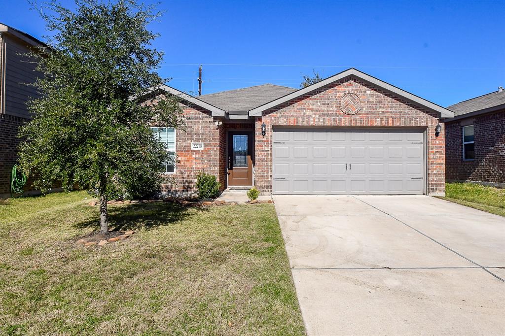 Charming single-story home with a welcoming facade, spacious driveway, and lush front yard. Perfect for comfortable living!