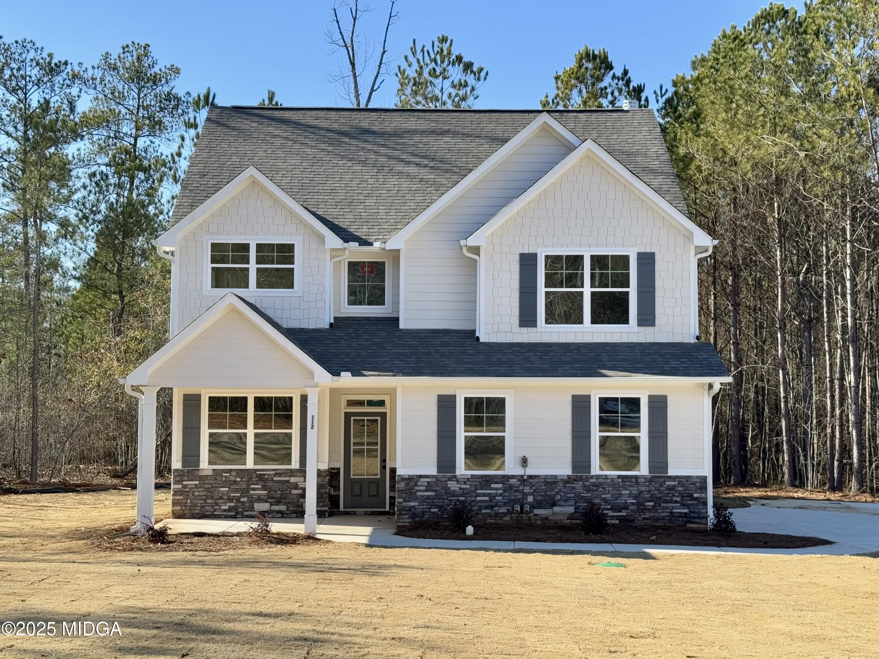 a front view of a house with a yard