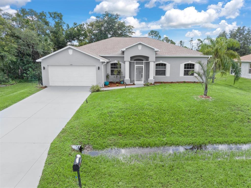 a front view of a house with a yard