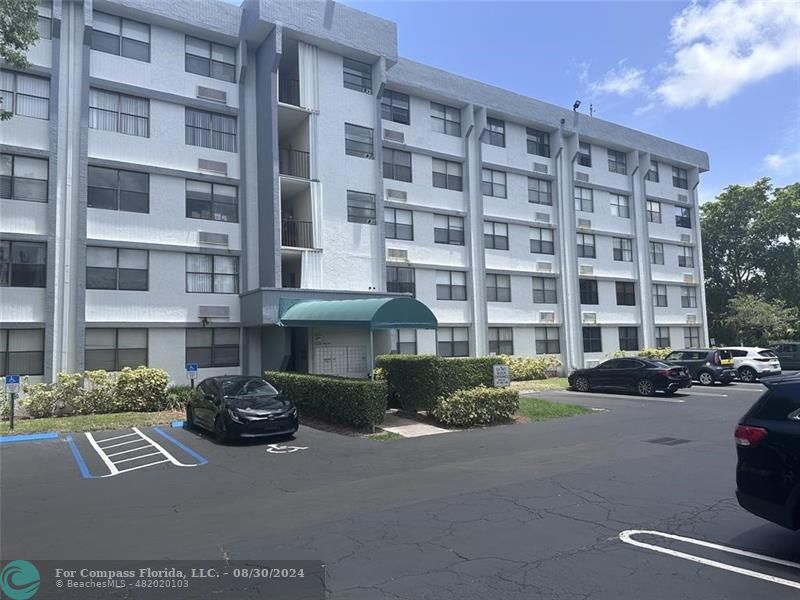 a front view of a building with street view