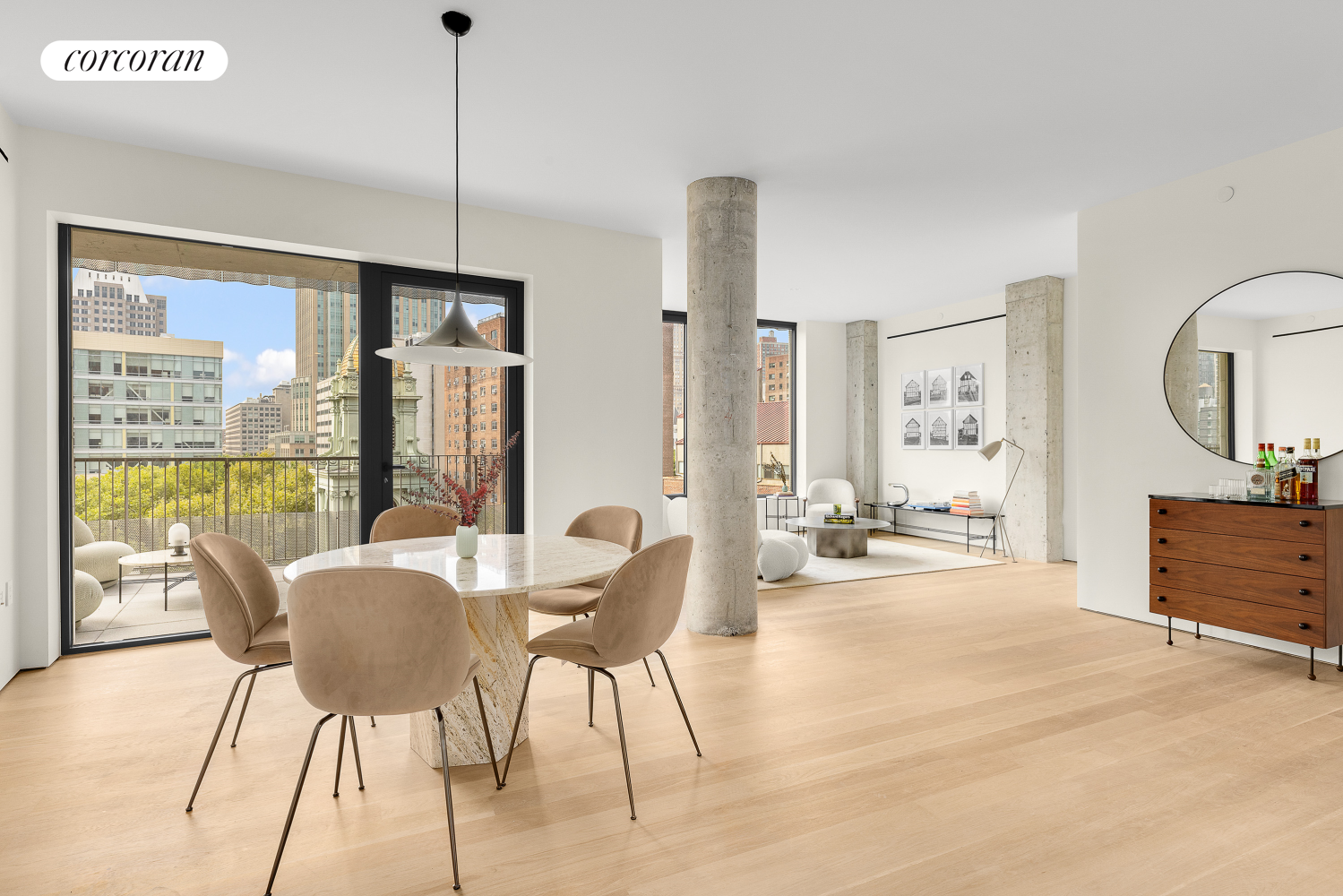 a view of a dining room with furniture a chandelier and wooden floor