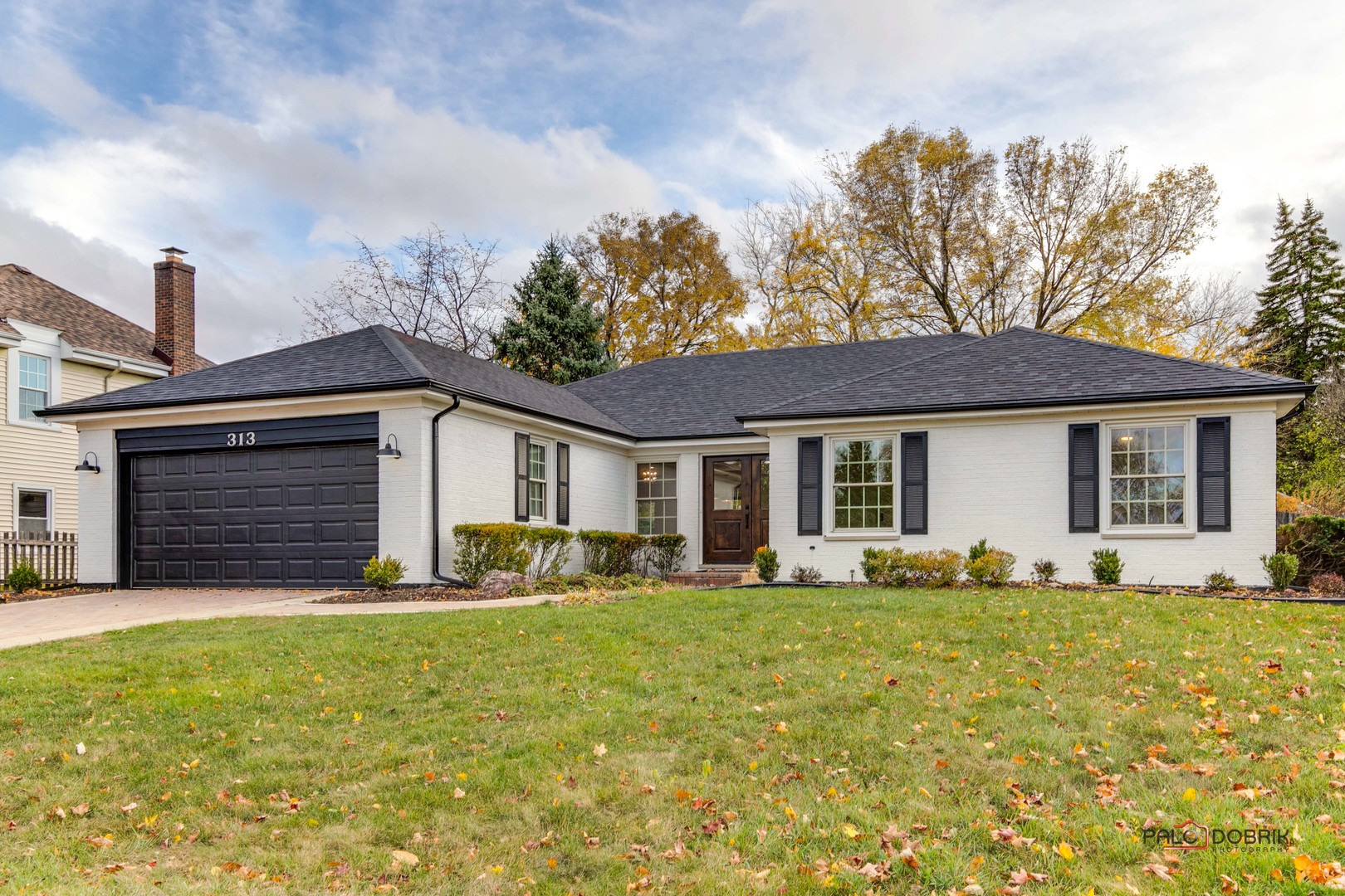 a front view of house with yard outdoor seating and barbeque oven