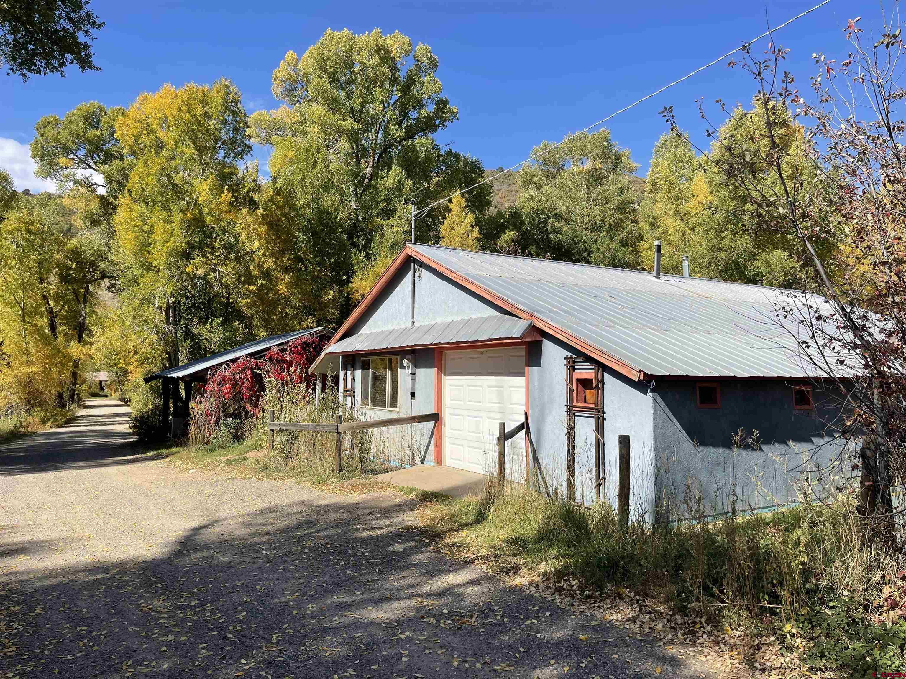 a house with trees in the background