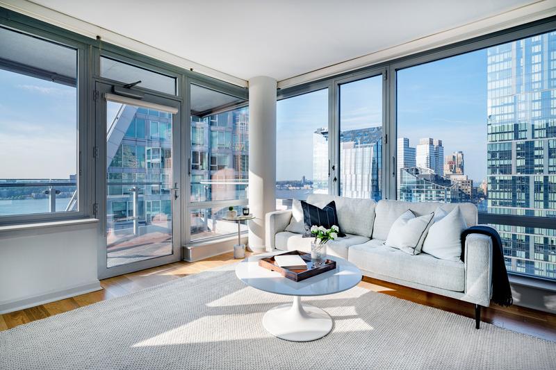 a living room with furniture and a large window