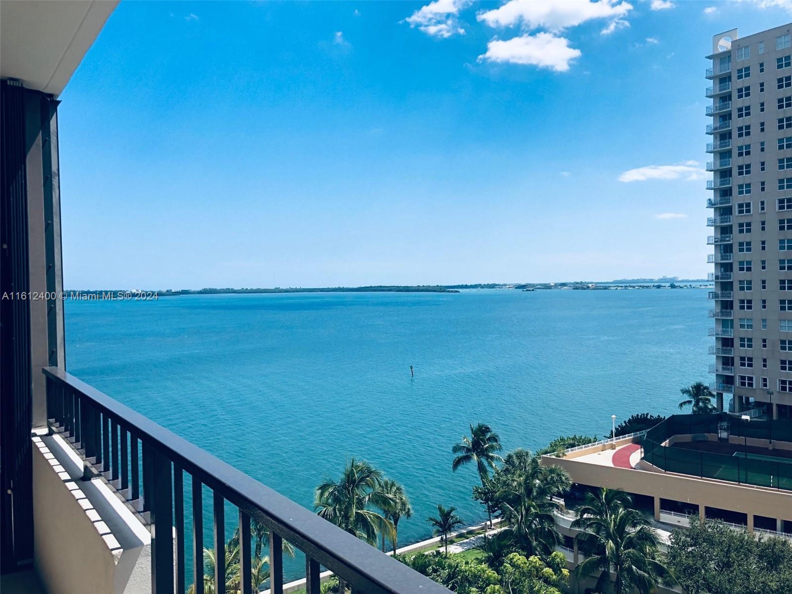 a view of a balcony with an ocean view