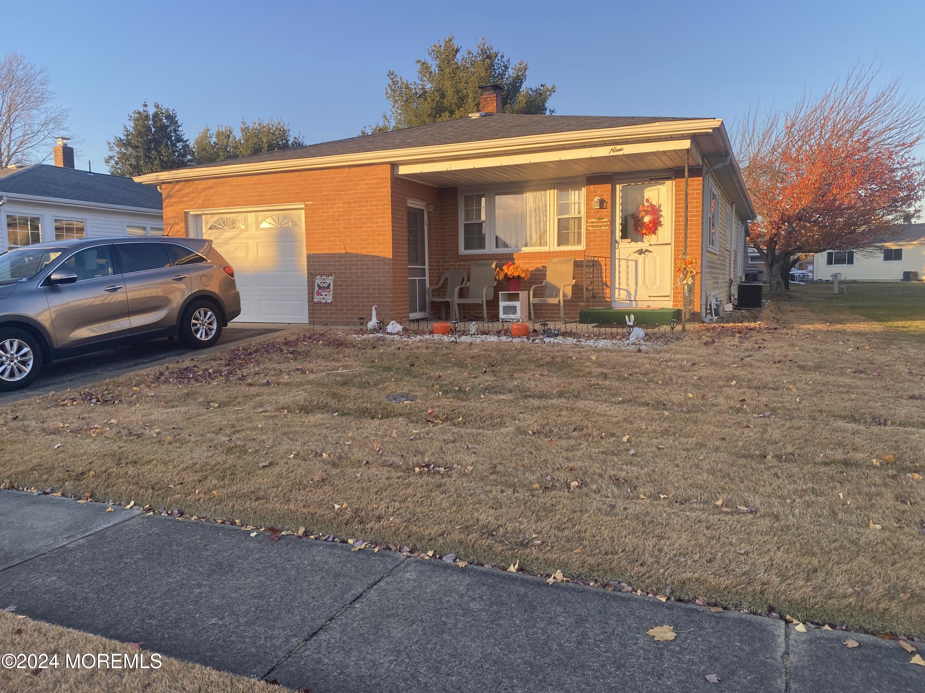 a view of a car parked in front of a house