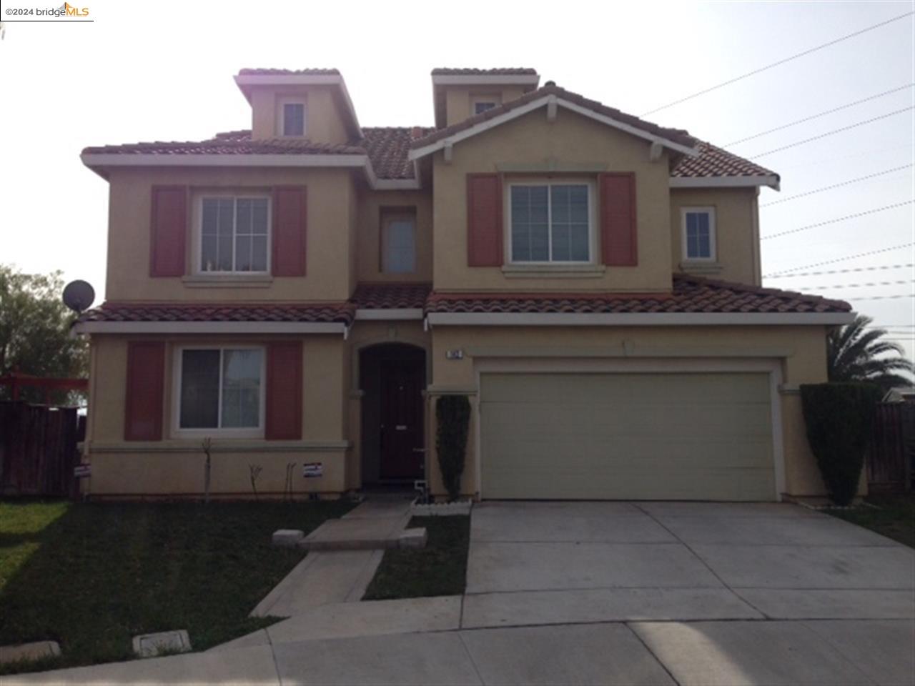 a front view of a house with yard