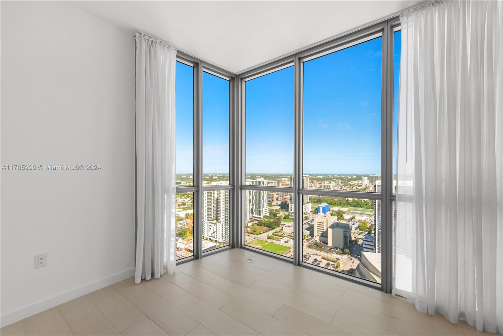 a view of an empty room and a balcony