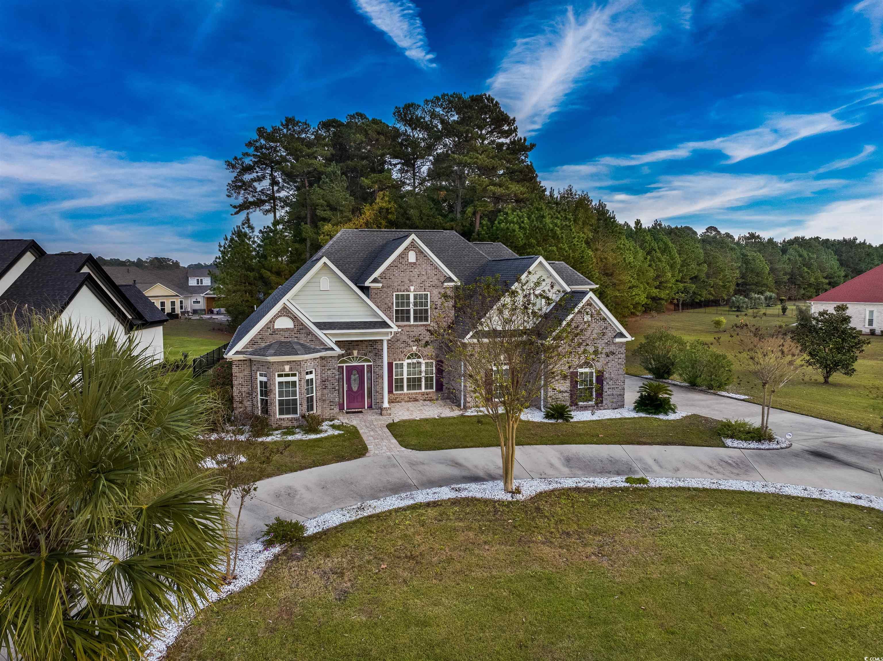 View of front of home featuring a front lawn