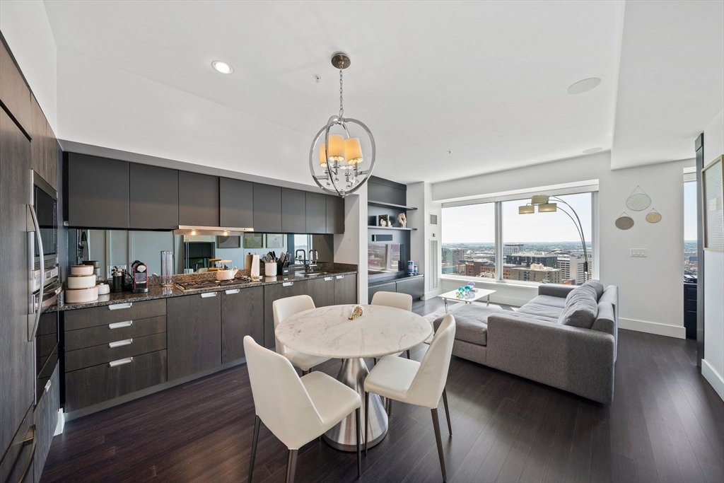 a very nice looking dining room with a large window and dining table