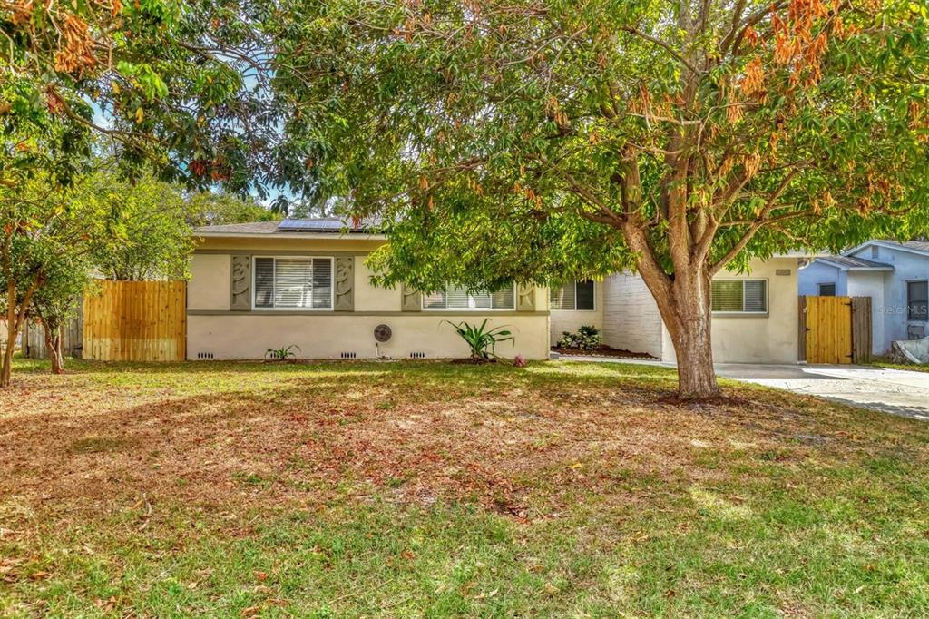 a house with trees in front of it