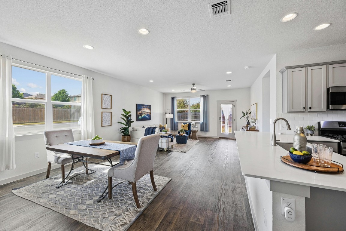 a view of a dining room with furniture window and wooden floor