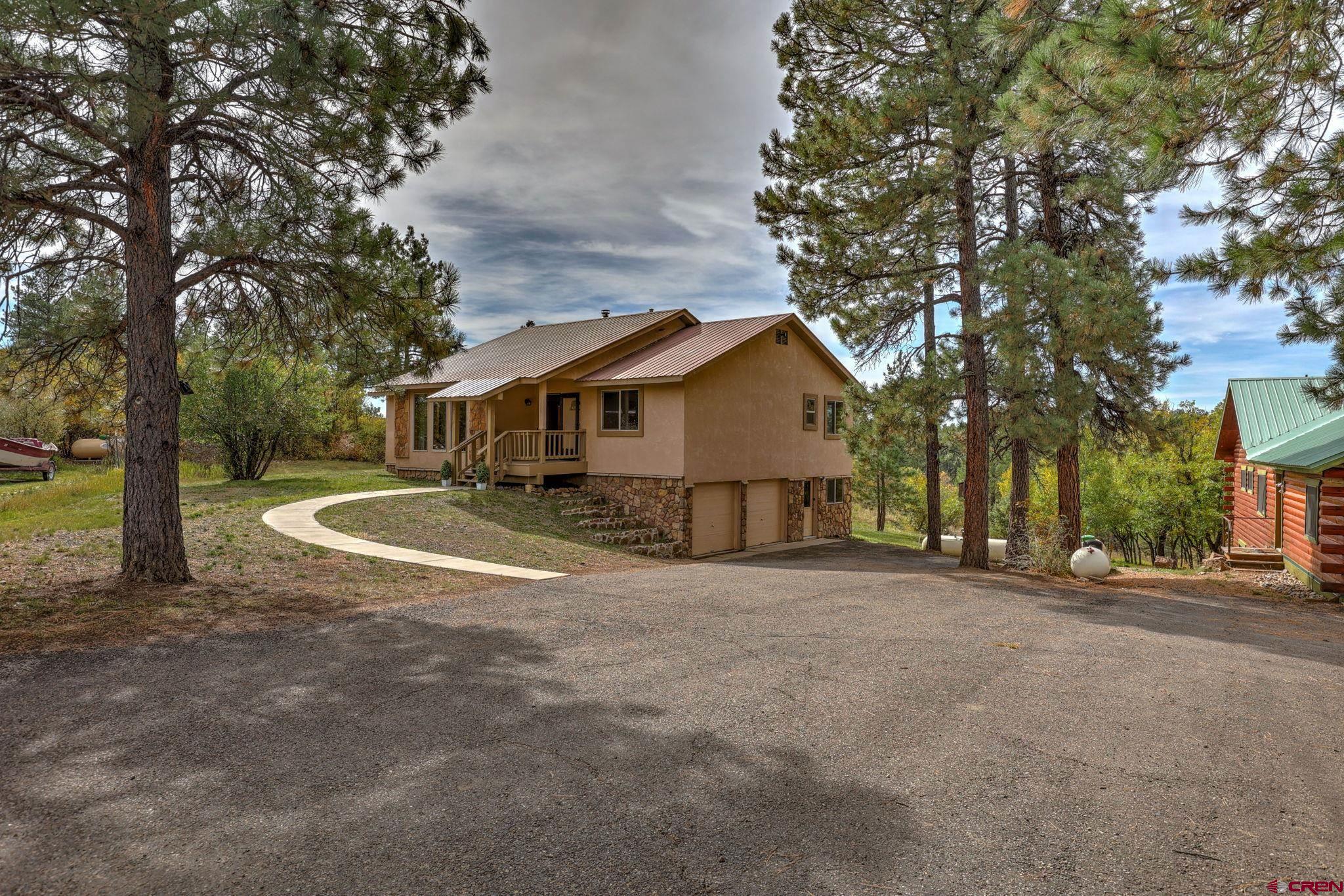 a view of a house with a yard