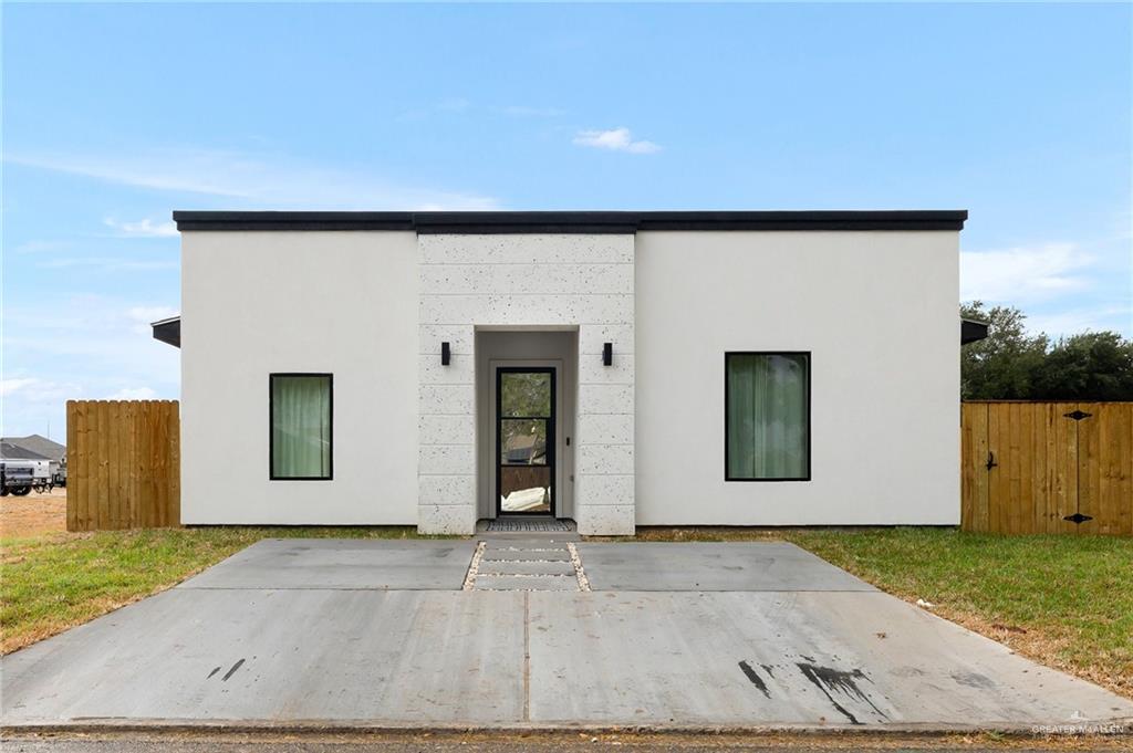 an entrance to house with yard