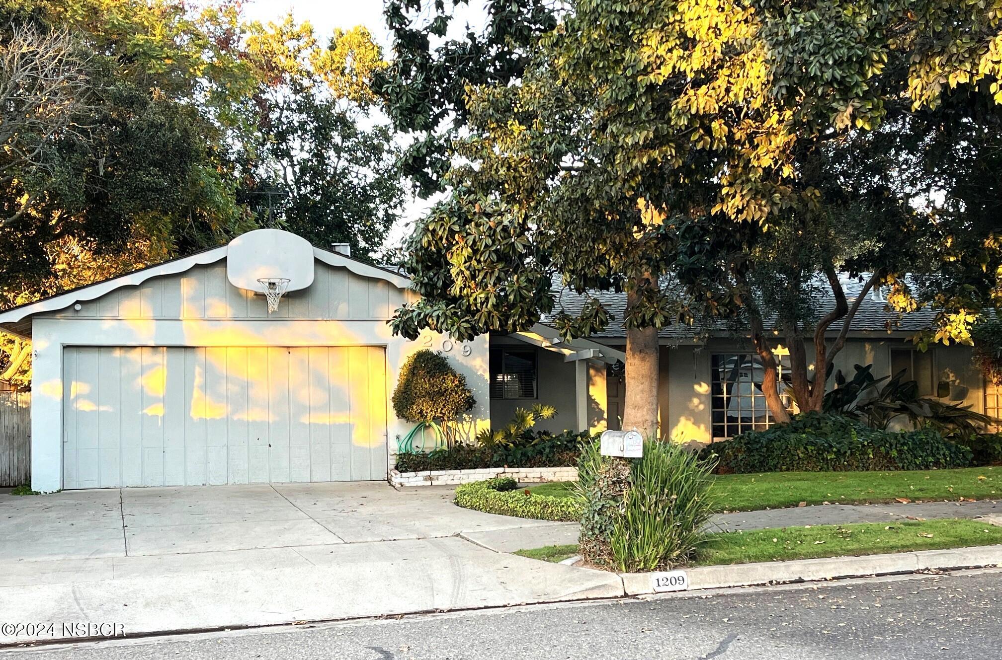 a front view of house with garage and yard