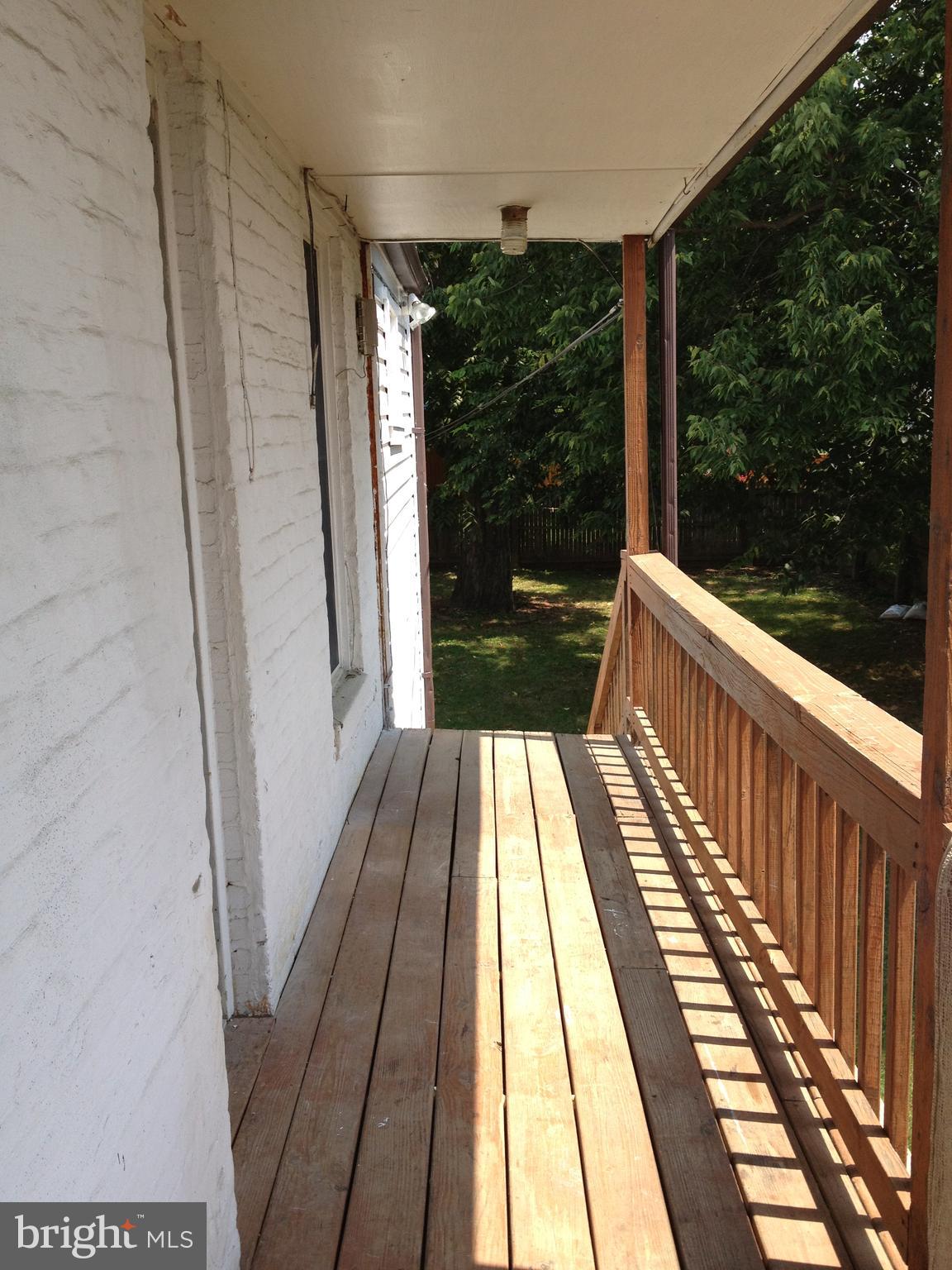 a view of balcony with wooden floor and outdoor space