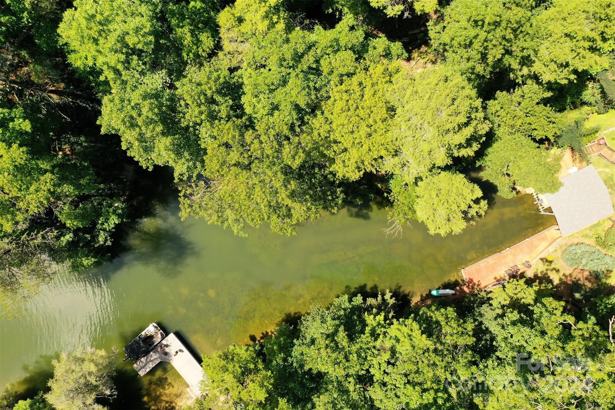 a view of a lake with a yard