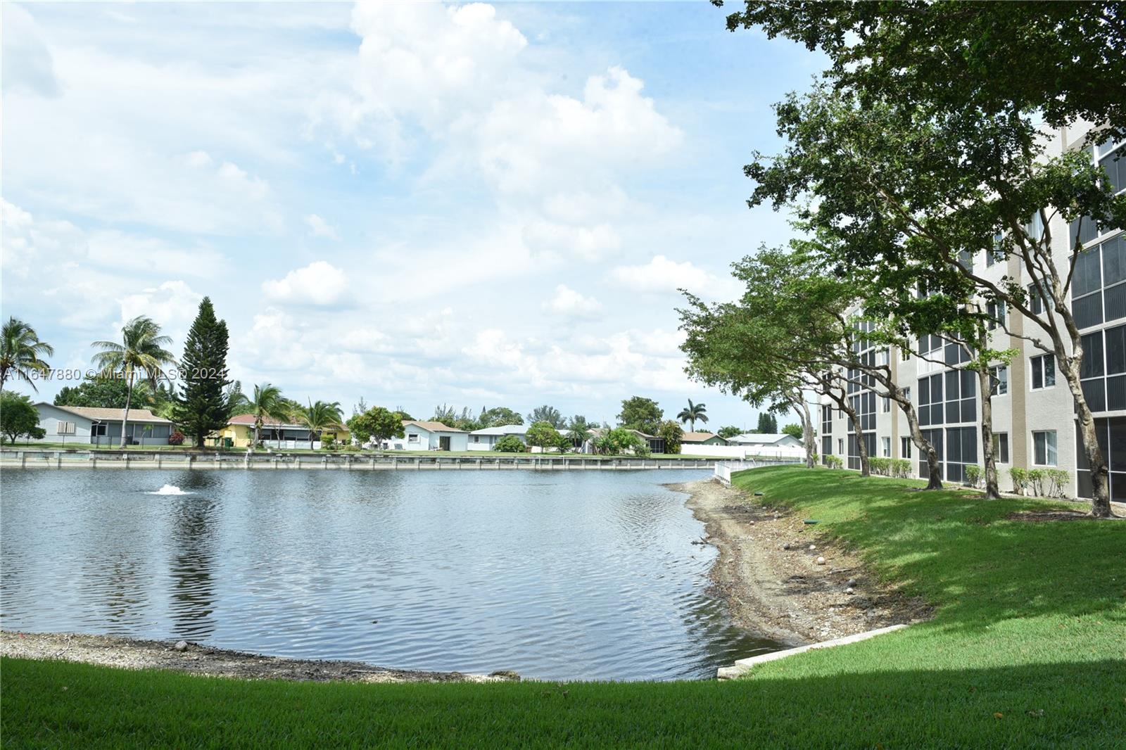 a view of a lake with houses in the background