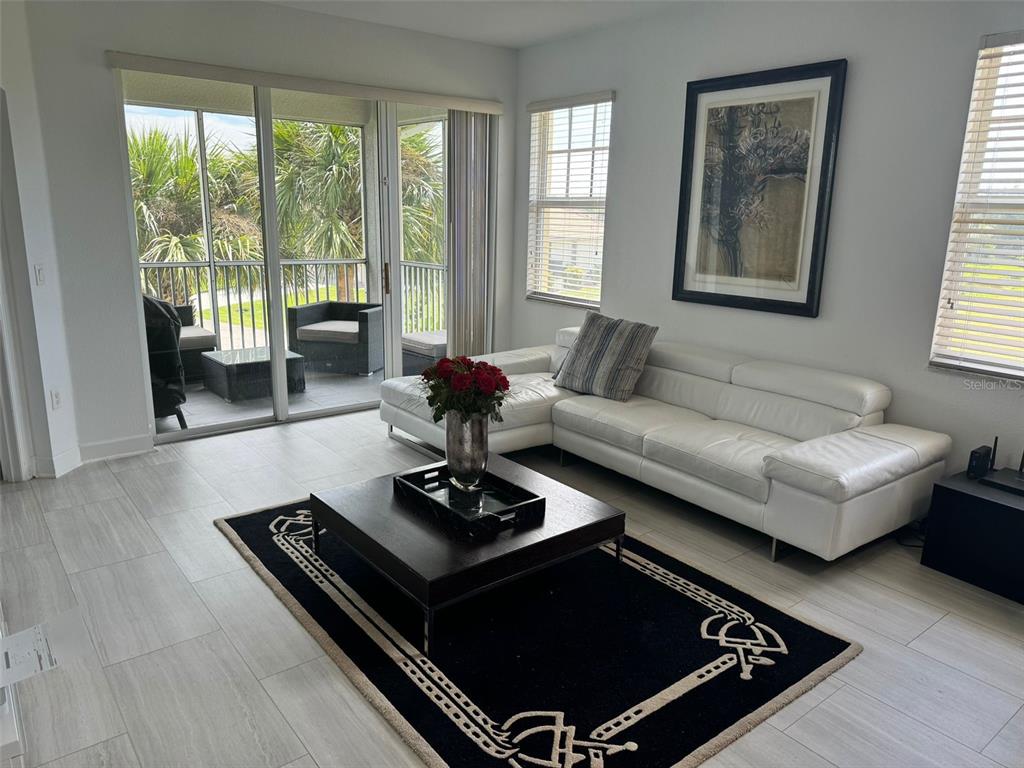 a living room with furniture rug and window