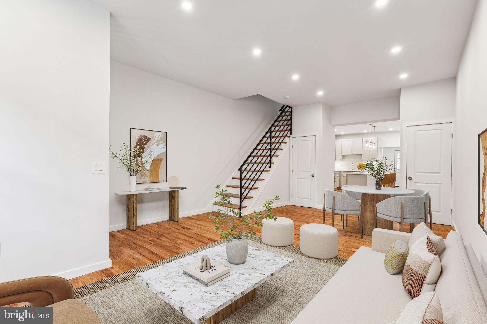 a living room with furniture and a potted plant