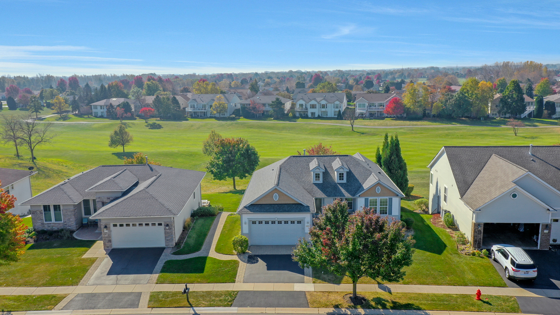 an aerial view of a houses with outdoor space and a lake view