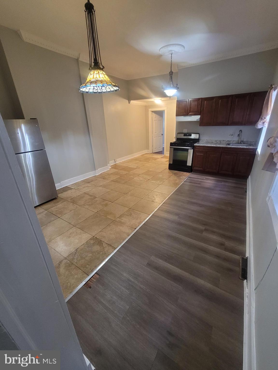 a view of a kitchen with a sink