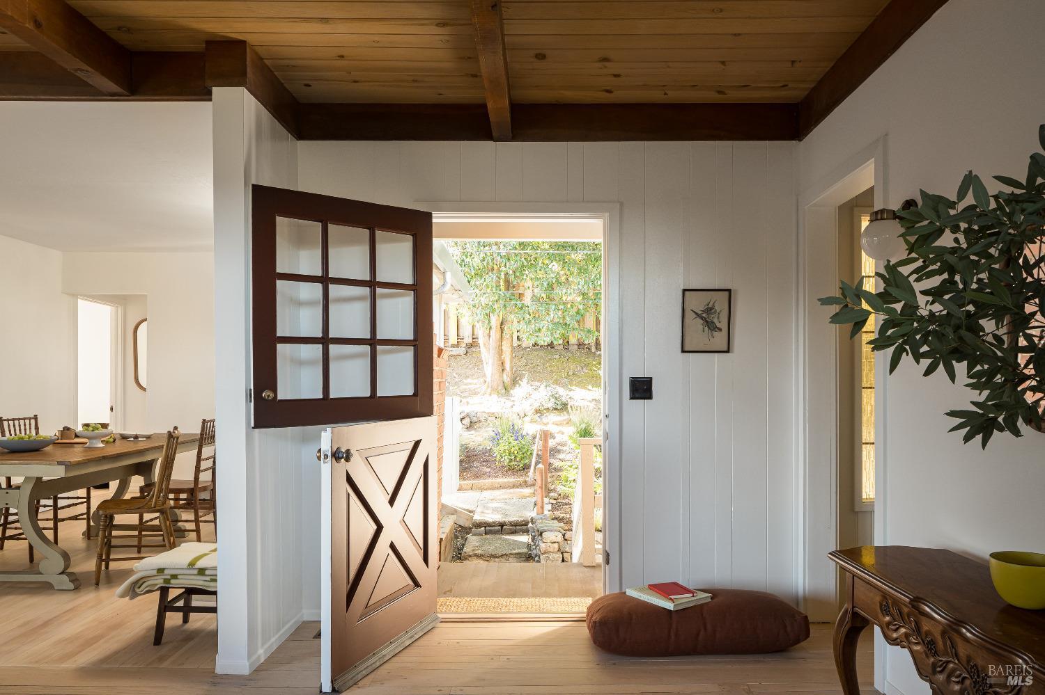 Dutch door entrance to main level with two bedrooms and two bathrooms.