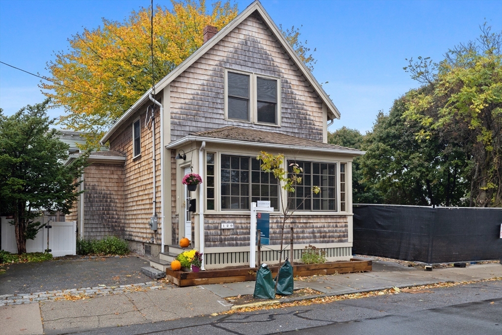 a front view of a house with street